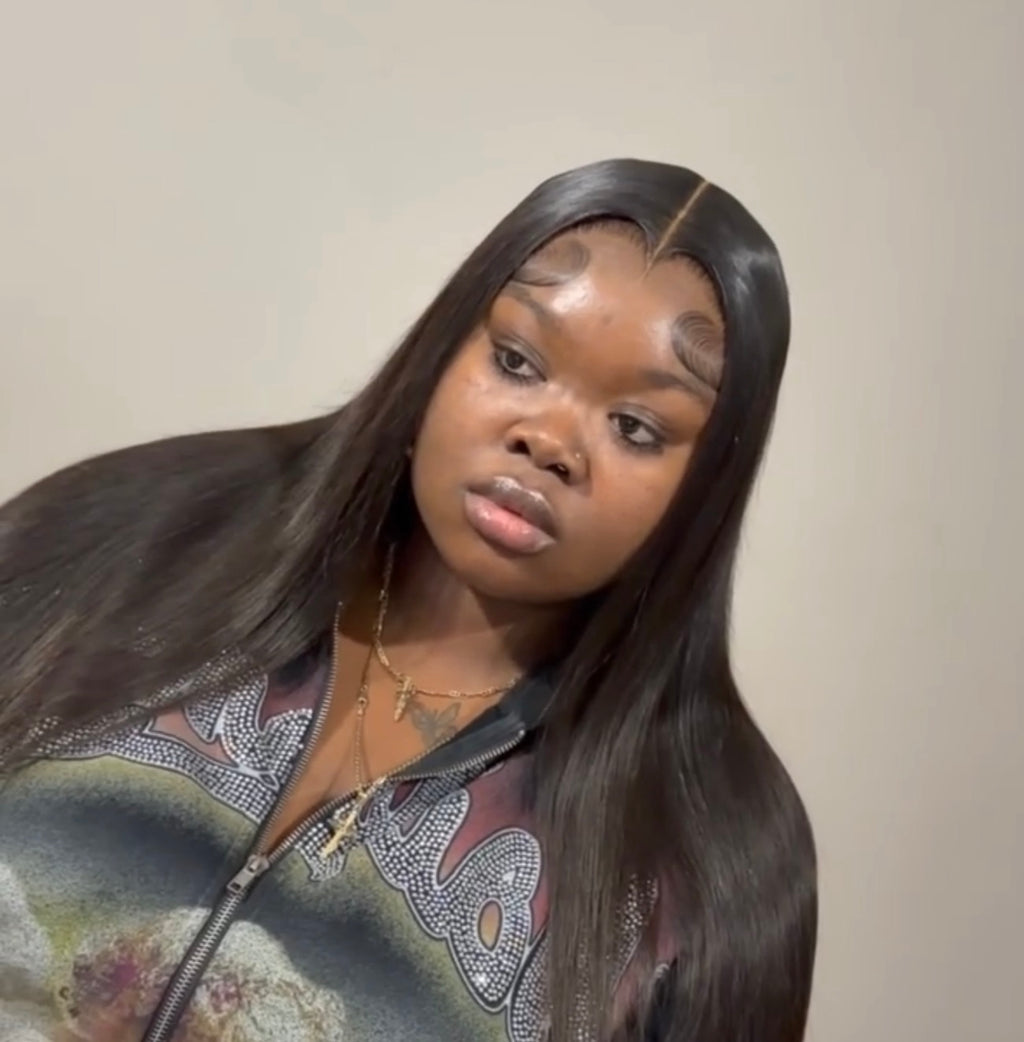 Long straight dark hair styled with a side part